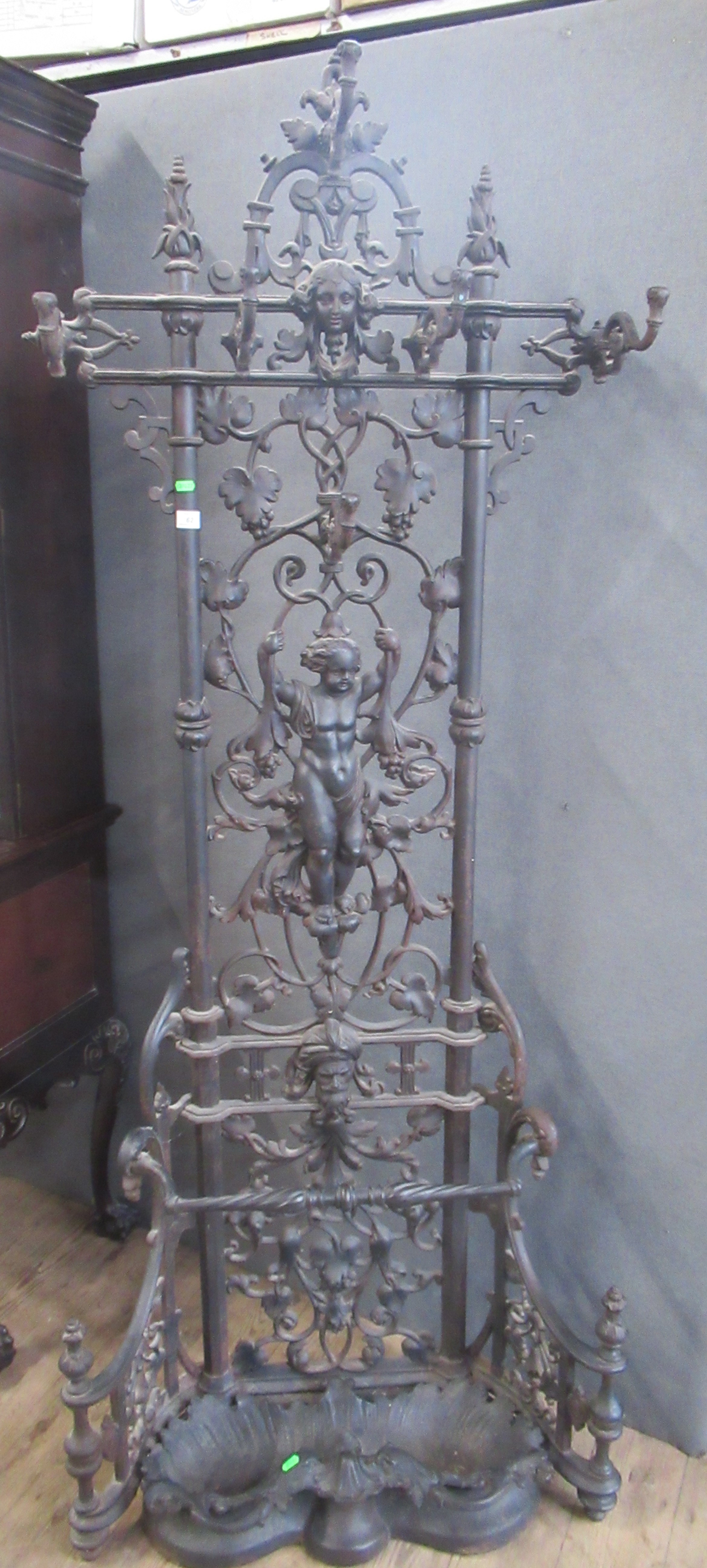 A Coalbrookdale hall stand with figures, trailing vine and marks with rope twist guard and scallop