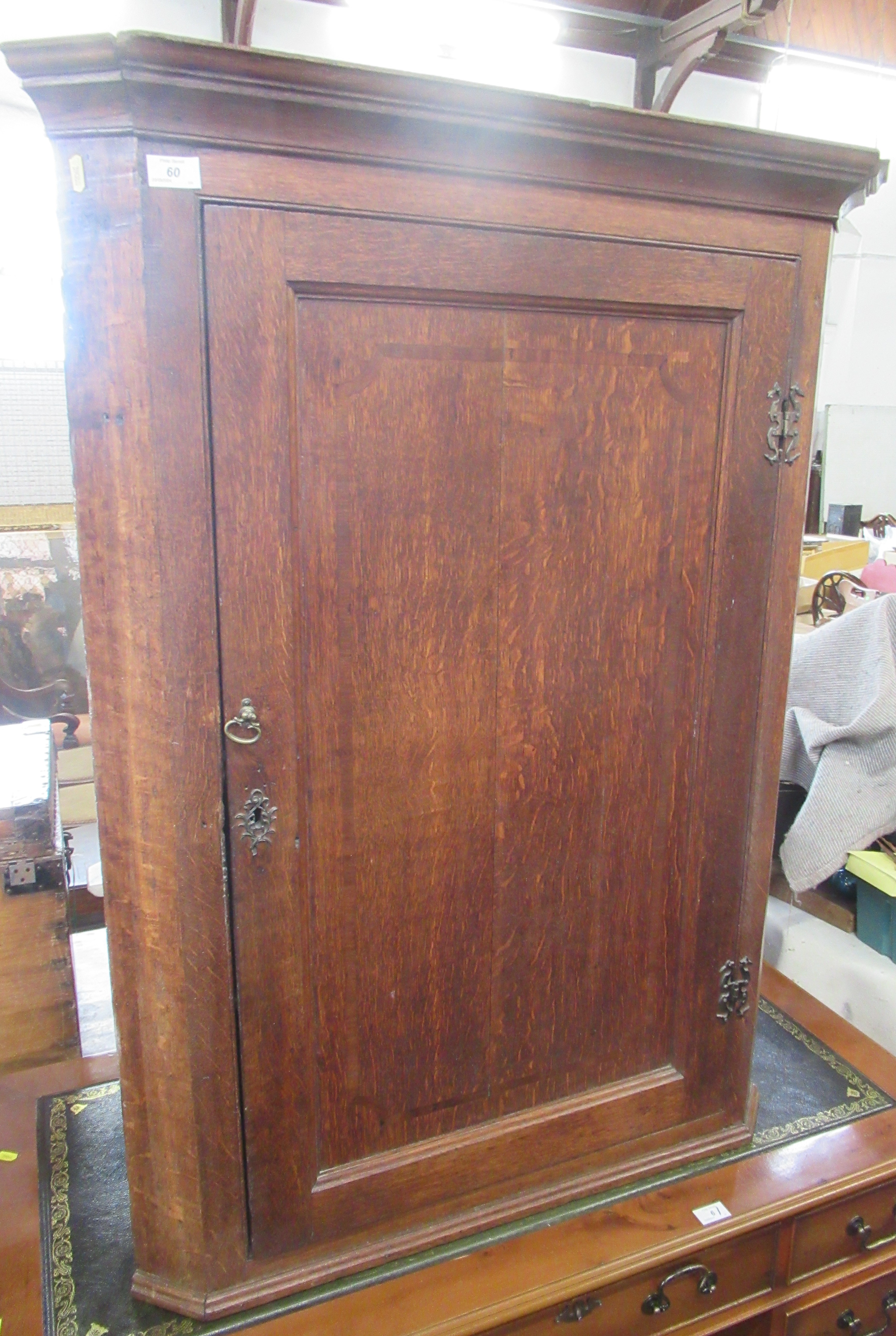 A Georgian oak corner cupboard, width 34ins
