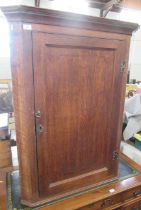 A Georgian oak corner cupboard, width 34ins