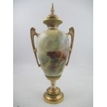 A Royal Worcester covered pedestal vase, decorated with Highland Cattle in landscape to the front
