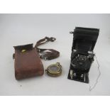 A ICA Dresden folding camera, together with a Short & mason Ltd London Army issue compass, in