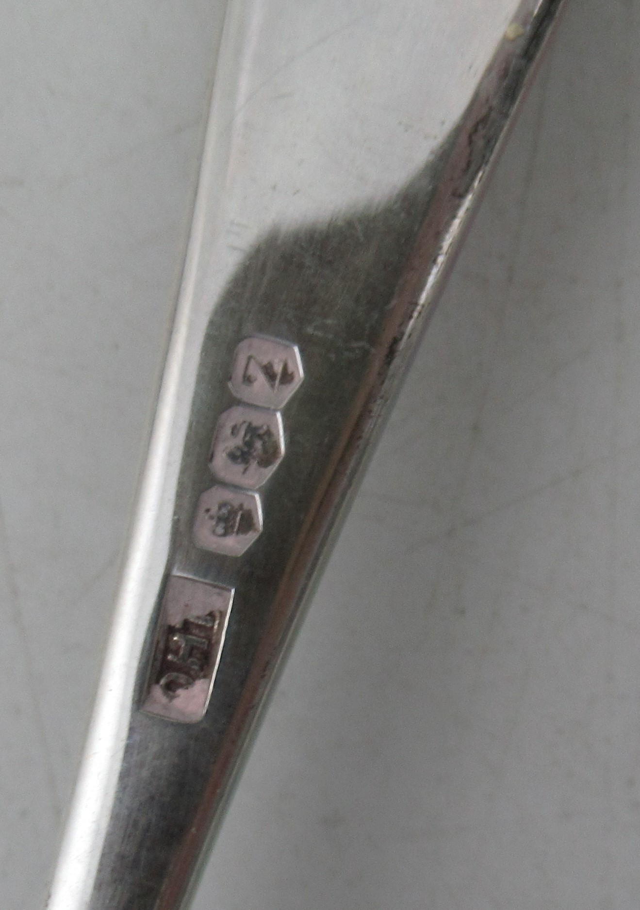 A Scottish silver fiddle pattern sauce ladle, together with three sugar tongs and a butter knife, - Image 4 of 4