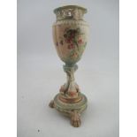 A Royal Worcester lobed blush ivory vase decorated with thistles supported by three dolphins