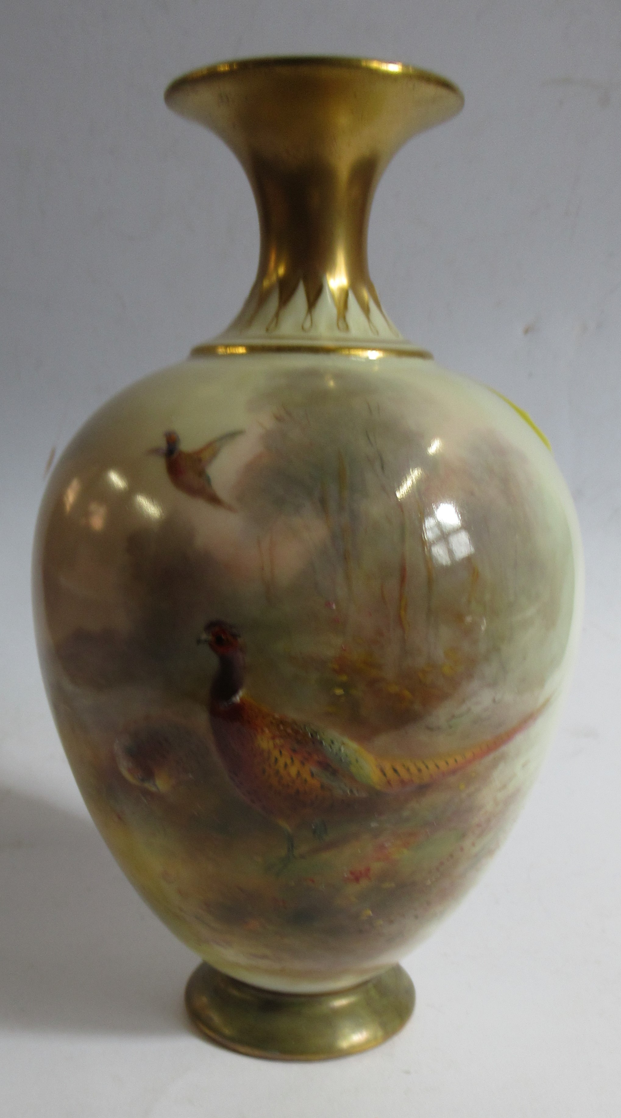 A Royal Worcester pedestal vase, decorated with pheasants in landscape by Jas Stinton, height 7ins