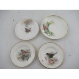 Two Royal Worcester miniature plates decorated with a Red Start, Black bird, Robin and a Linnet by