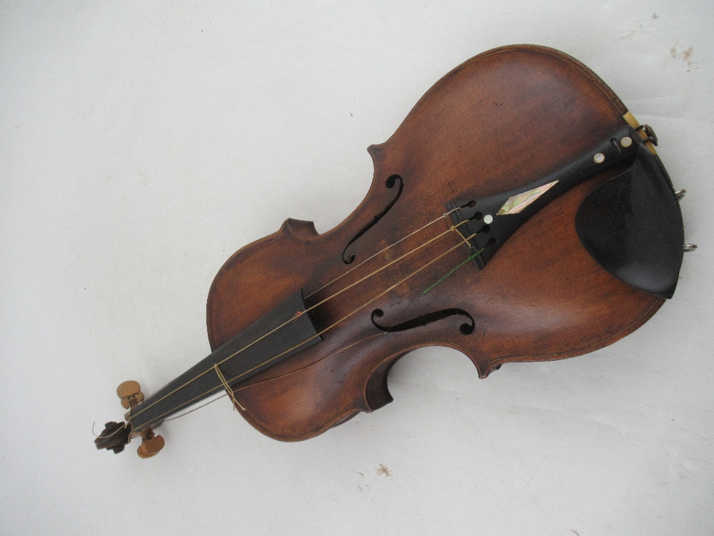 A cased violin, with two piece back, bearing label for repairer M. Andersen