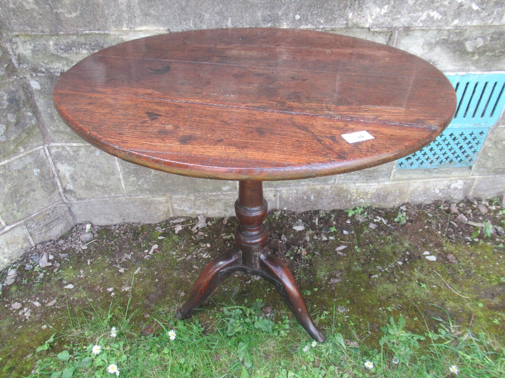 A 19th century oak tilt top tripod table, diameter 27ins