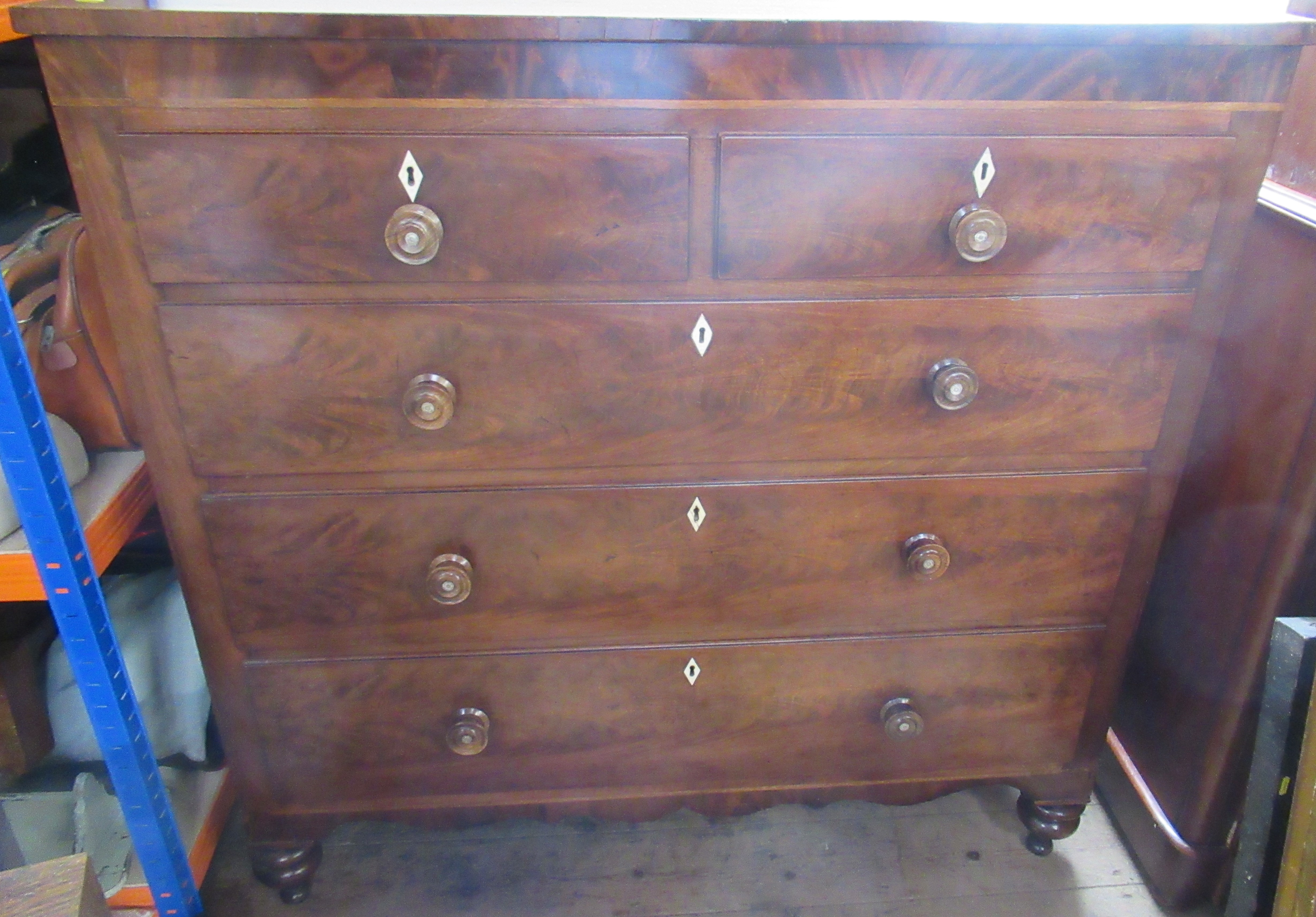 WITHDRAWN A large 19th century mahogany chest of drawers, with two short drawers over three long