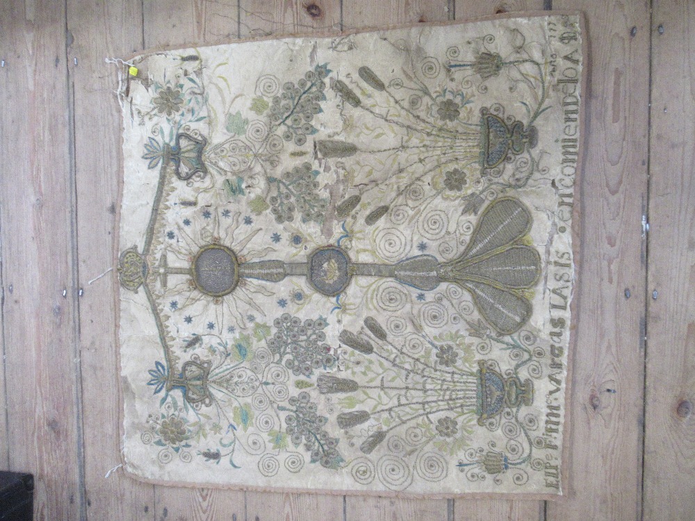 A square antique needlework panel, a central sunburst motif with cross over with further