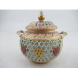 A Royal Worcester reticulated sugar bowl and cover by Henry Bright, with small vignette landscape