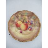 A Royal Worcester plate decorated with fruit by Price to a shaped gadroon boarder  diameter 7.25ins