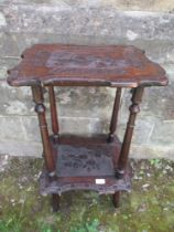 An Arts and Crafts style occasional table, the top decorated with birds and foliage, raised on