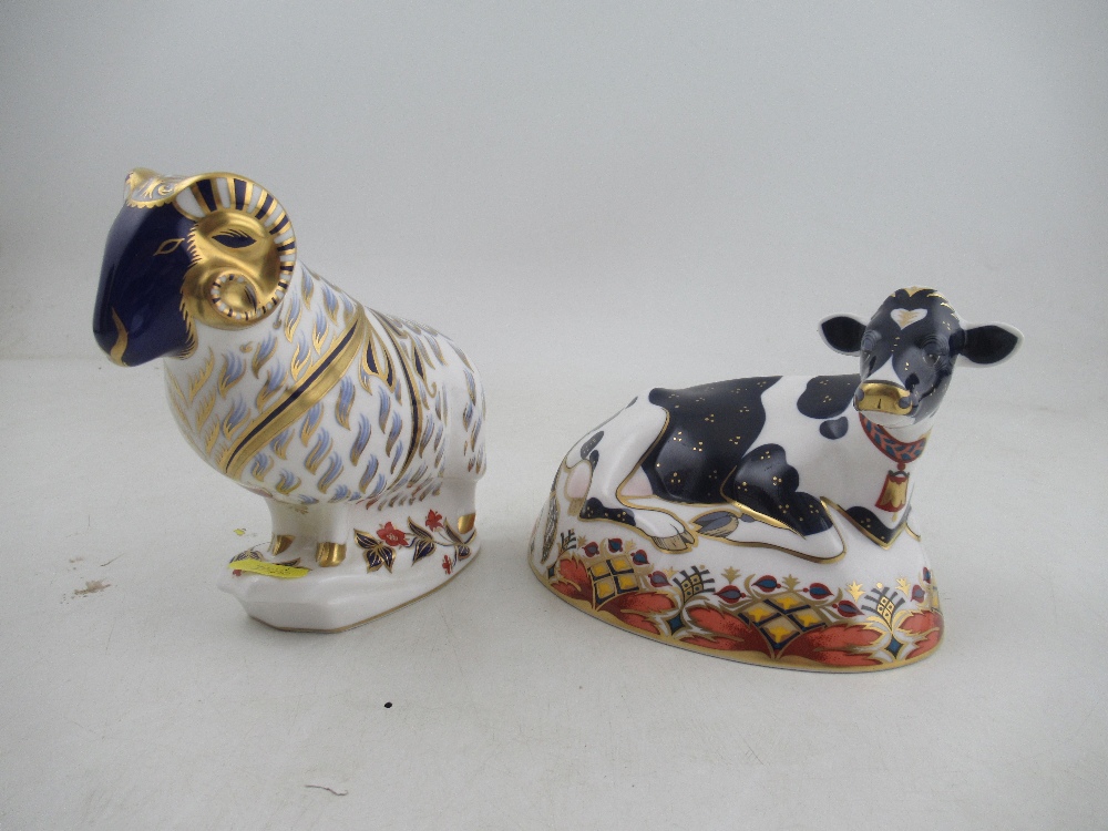 A Royal Crown Derby paperweight of a Ram and a Friesian Cow