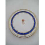 A Graingers Worcester circular stand decorated with a D below a coronet to a blue boarder diameter