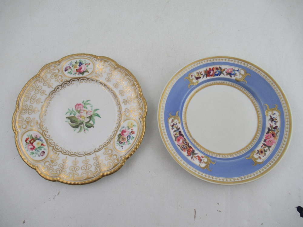 A Grainger's Worcester plate decorated with panels of flowers to a gilt boarder diameter 9.25