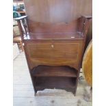 An Edwardian narrow bureau, with cross banded decoration, the drop flap revealing drawers and pigeon