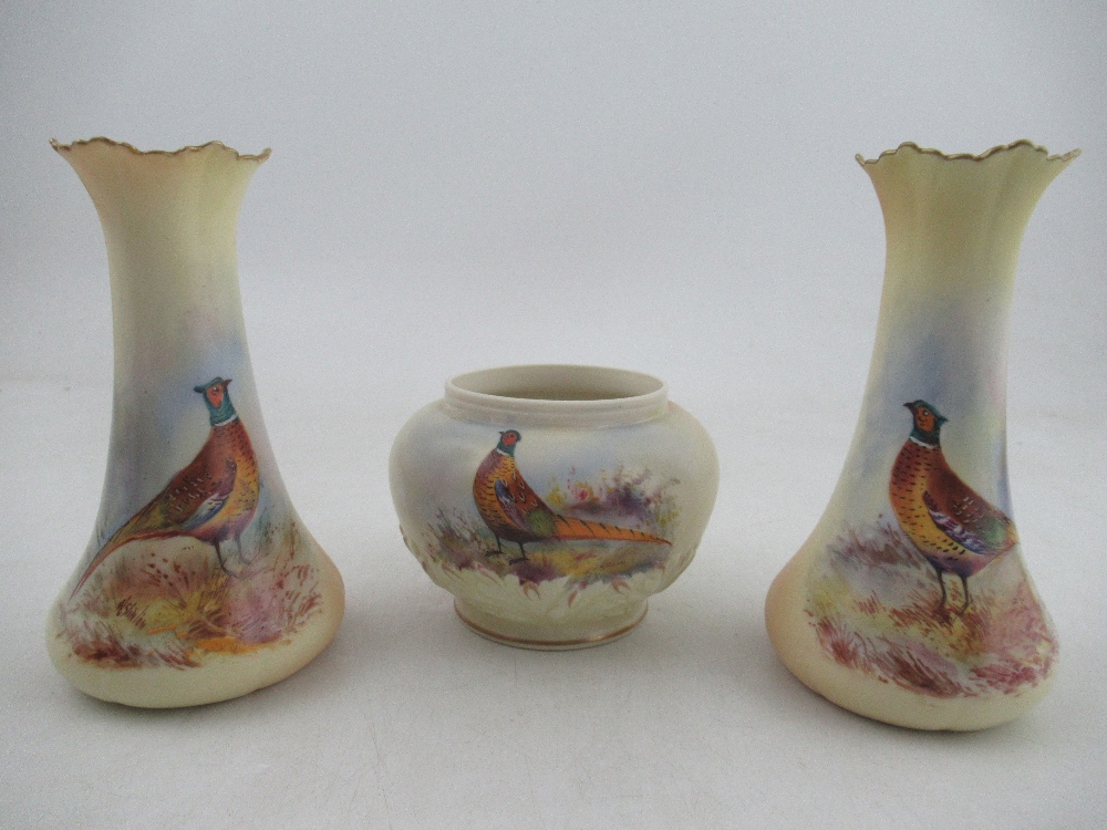 A pair of Locke & Co Worcester blush ivory vases, decorated with pheasants by W Stinton, height 5.