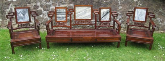 A Chinese hardwood three piece suite, with marble insets, the settee width 69ins