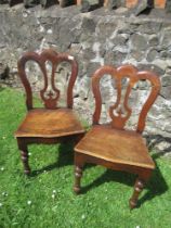 A pair of 19th century mahogany hall chairs