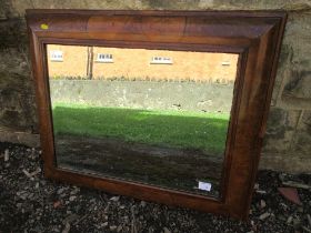 A 18th century design walnut cushion framed mirror, with beveled plate, 18ins x 24ins, total