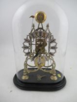 Skeleton Clock with pierced silver Chapter Ring twin chain under a glass dome