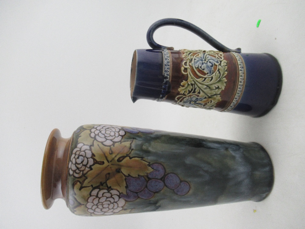 A Royal Doulton stoneware vase, decorated with a grape vine, height 12ins, together with a Doulton