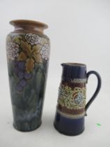 A Royal Doulton stoneware vase, decorated with a grape vine, height 12ins, together with a Doulton