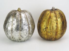 A gilded melon table centrepiece together with a matching silver coloured example, 31cm high.