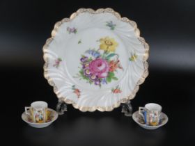 A Dresden porcelain serving dish, decorated with floral sprays, 25cm diameter, together with a