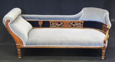 A Victorian salon settee, with curved padded top rail, with stuff over seat on ring turned legs,