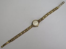 A Ladies Accurist 9ct Gold Cased Wristwatch on a 9ct gold bracelet, 8g without movement. A/F