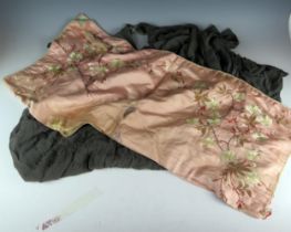 A Chinese pink shawl with embroidered floral and butterfly decoration with pale blue lining,