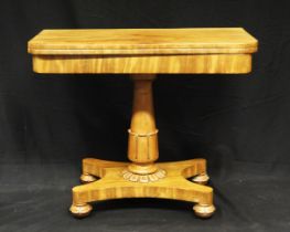 A Victorian mahogany folding card table, the hinged top with baize lining, raised on a turned column