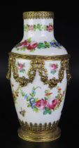 A Sevres porcelain and gilt metal mounted vase of ovoid form, with painted floral garland