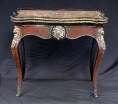 A 19th century French scarlet tortoiseshell and boulle work card table, the hinged top of serpentine