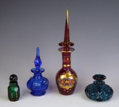 A continental ruby glass and gilt decorated scent bottle, together with three other glass scent