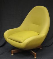 AV Greaves & Thomas egg swivel chair, with pale yellow loose cover on an X-frame base.