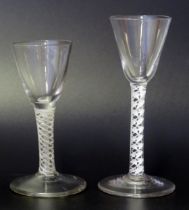 A 19th century wine glass with inverted bell-shaped bowl on an opaque twist stem and circular