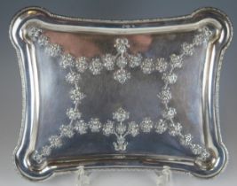 A continental silver dressing table tray, stamped marks, of rectangular outline, with rounded