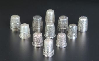 A collection of eleven assorted silver and plated thimbles, various makers and dates, weighable