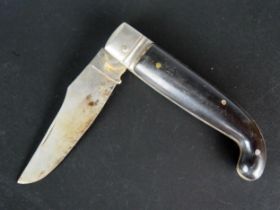A folding knife with 7cm blade, 19cm fully extended.