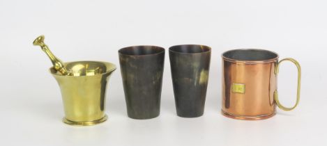 A pair of horn beakers, 10.5cm high, a brass pestle and mortar, a copper measure. (4).