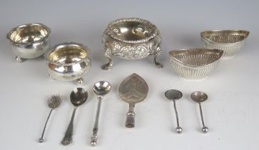 A mixed collection of silver condiments including a pair of oval salts, a Victorian salt, assorted