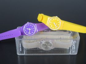 A SWATCH Silver Glistar Watch _ LK343E (boxed) and two others (purple running)