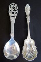 Two continental silver preserve spoons, total weight of silver 45gms, 1.49ozs