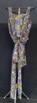 A 1920's/30's silver lame and coloured cotton bodice and bow of floral design.