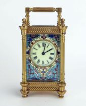 A late 19th century French gilt brass and champlevé enamel travelling timepiece, with 4.5cm Roman