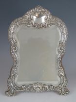 An Edward VII silver framed easel dressing mirror, maker Henry Matthews, Birmingham, 1903, of arched