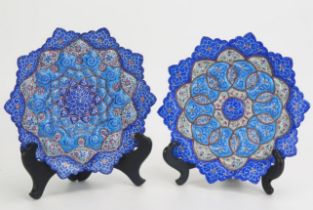 A pair of Persian enamel dishes, of petal design with all-over flowerhead decoration, 20cm diameter.