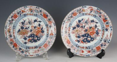 A pair of Chinese Imari porcelain plates, the floral decoration heightened with gilt, 23cm diameter.